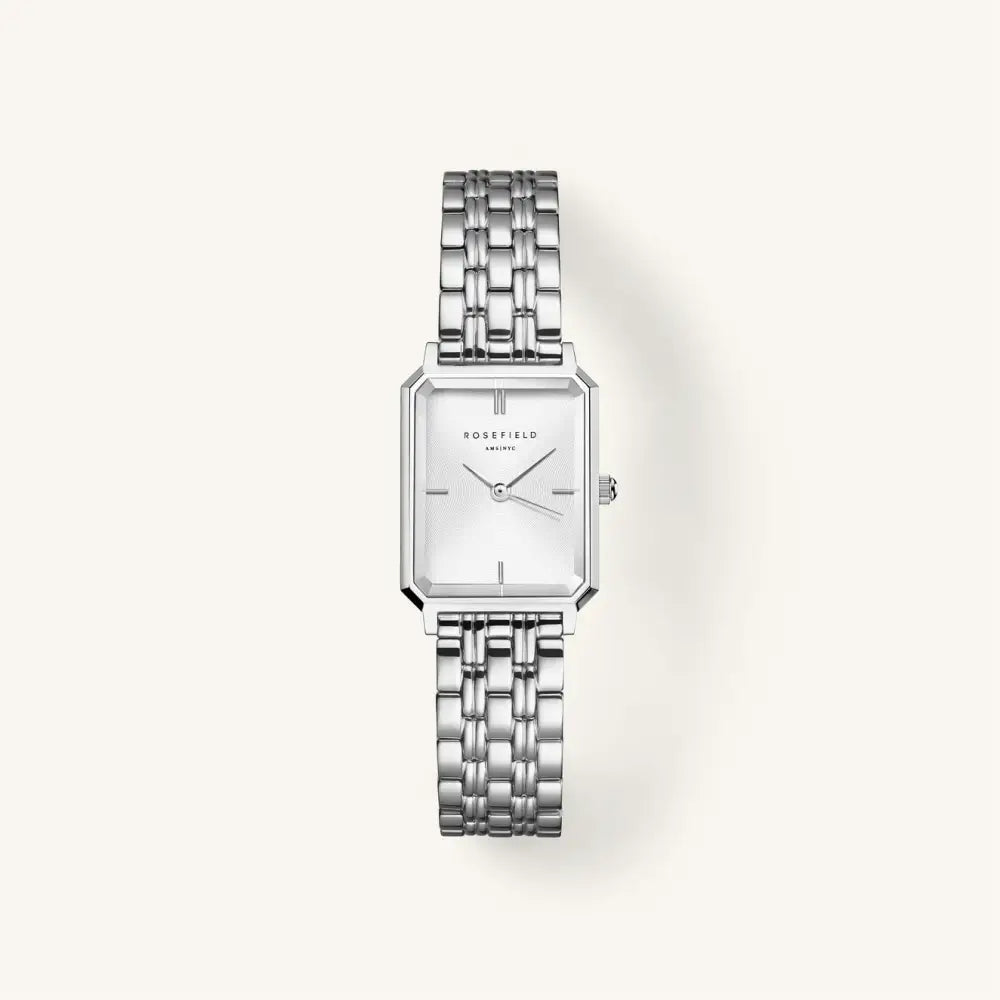 Zilveren rechthoekige horloge met wit zonnestraal patroon en staal afwerking