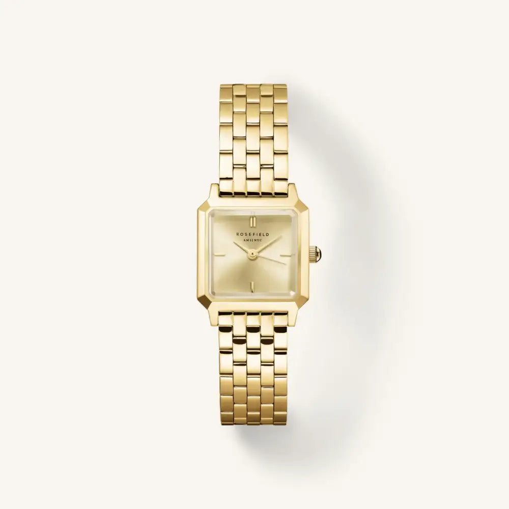 Goldkleurige vierkante polshorloge van The Boxelle merk met gouden staalband